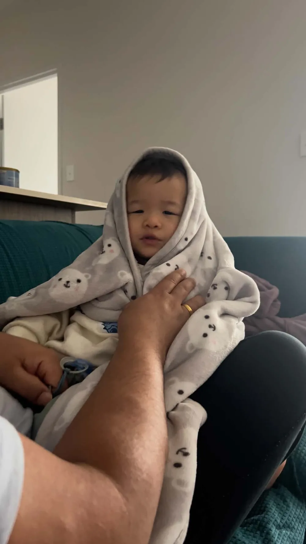 Aira wrapped up snugly in a soft blanket